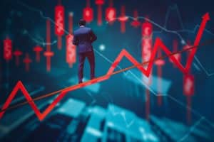 Financial investment volatility, up and down arrows profit graph due to Coronavirus crisis, businessman trying to balance like a tightrope walker so that volatility does not gobble up his investments